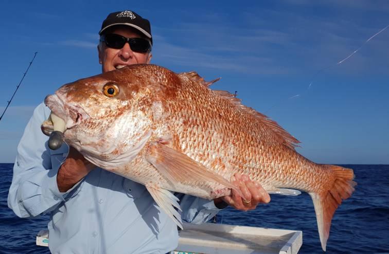Andy with a huge Snapper caught on downrigger shop big soft plastics