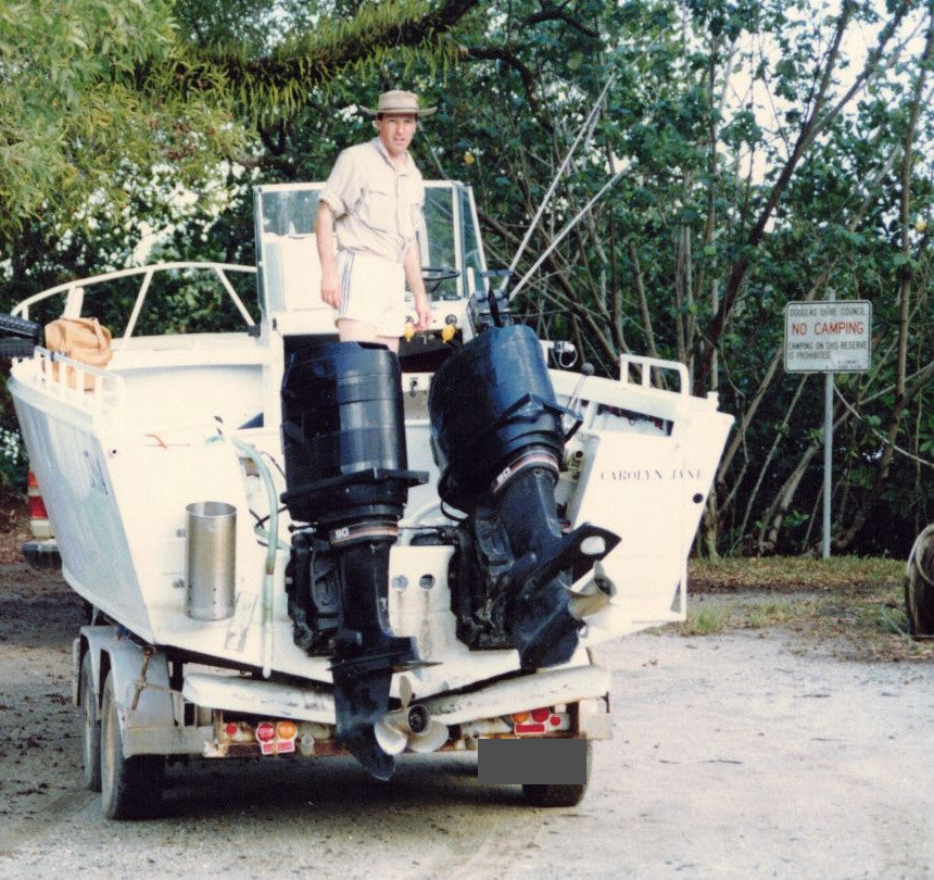 21-foot plate-alloy fishing boat on its trailer