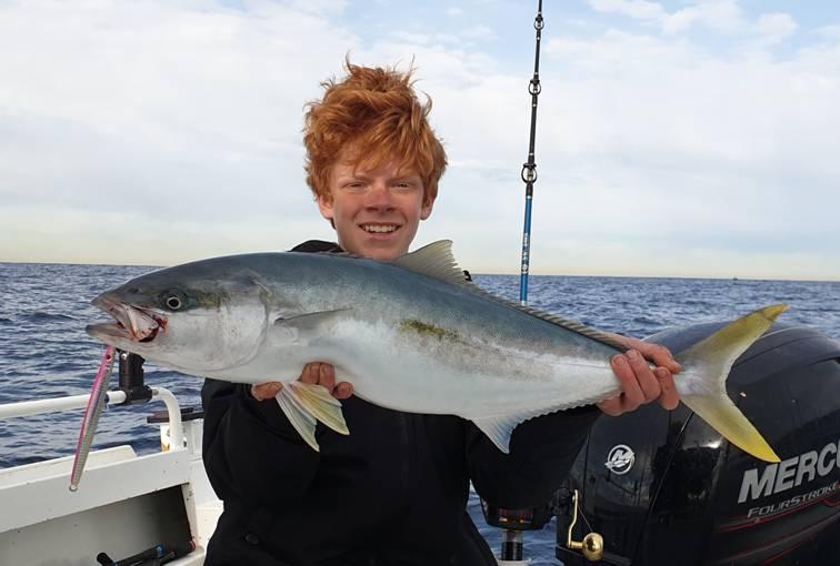 Xavier with his first kingfish caught on a 100 gram jig at The Peak off Sydney