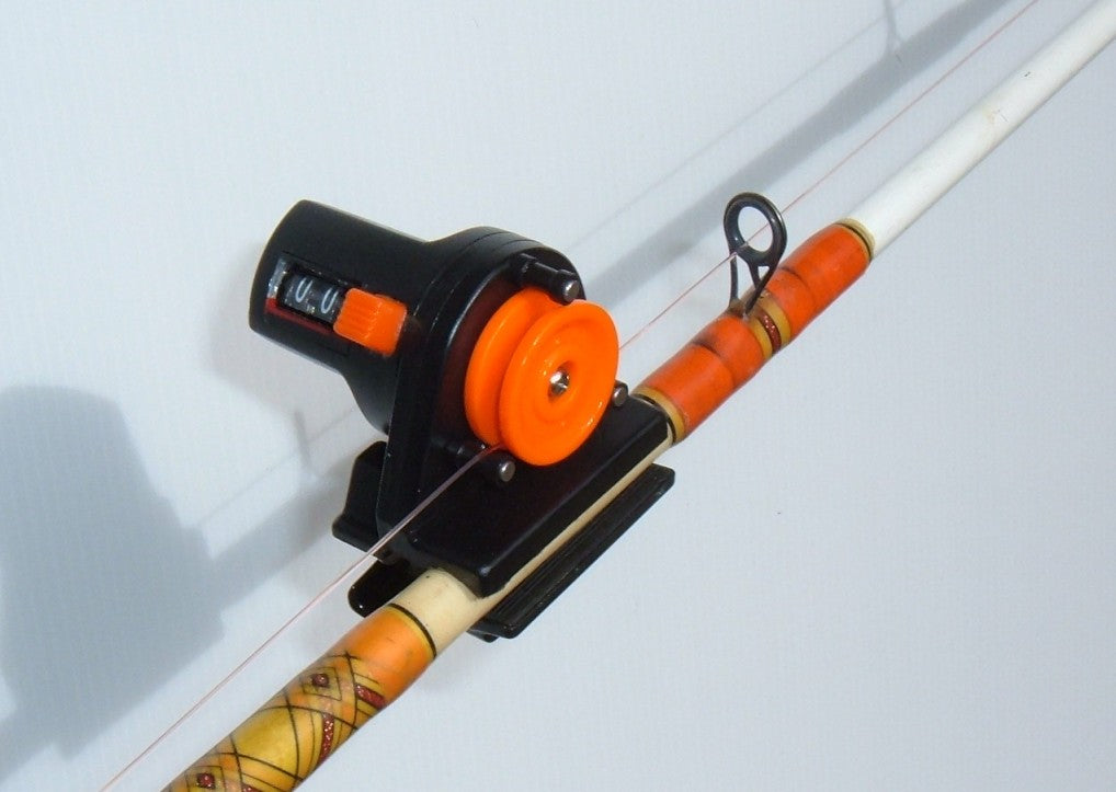 Fishing line counter used while jigging to compare line out with sounder depth