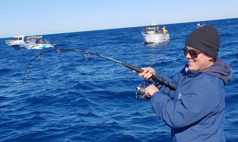 Angler hooked to a kingfish while mechanical jigging at Twelve Mile Reef off Sydney